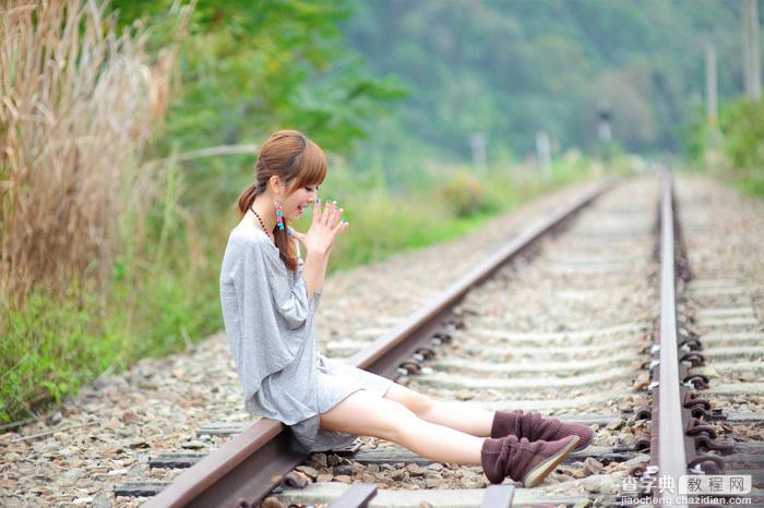 Photoshop为坐在铁轨的美女加上甜美的淡调粉绿色1